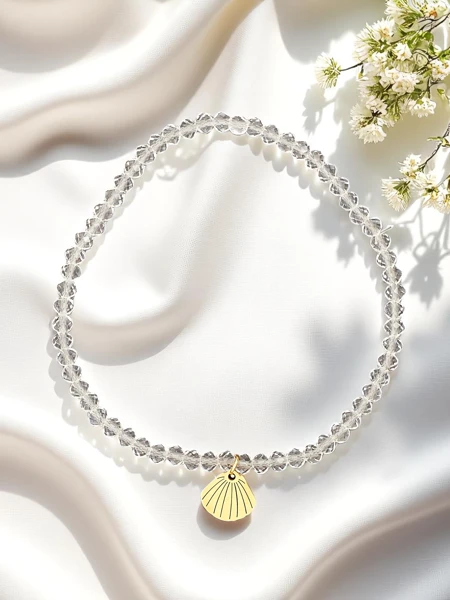 Royalfashion Bransoletka damska z zawieszką muszelki