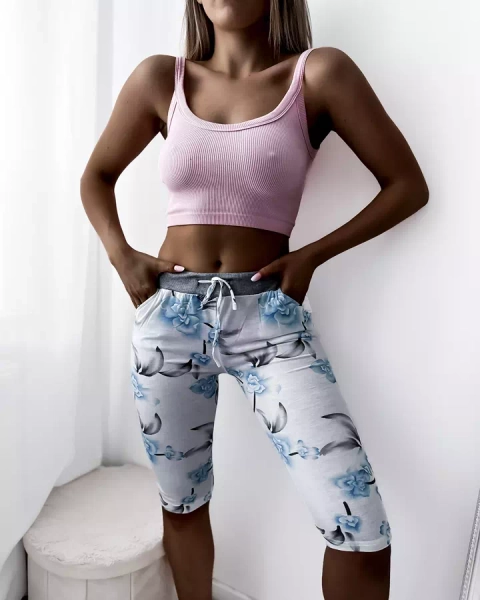 Royalfashion Białe damskie spodenki 3/4 z kwiatowym wzorem