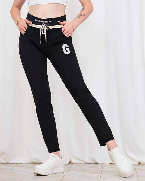 Royalfahion Damskie czarne spodnie w sportowym stylu z naszywką PLUS SIZE