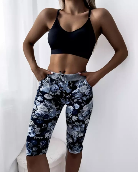 Royalfashion Niebieskie damskie spodenki 3/4 z kwiatowym wzorem