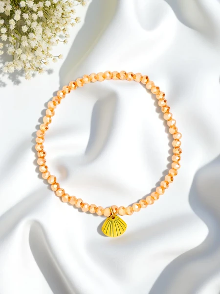 Royalfashion Bransoletka damska z zawieszką muszelki