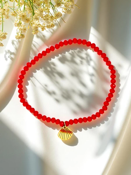 Royalfashion Bransoletka damska z zawieszką muszelki