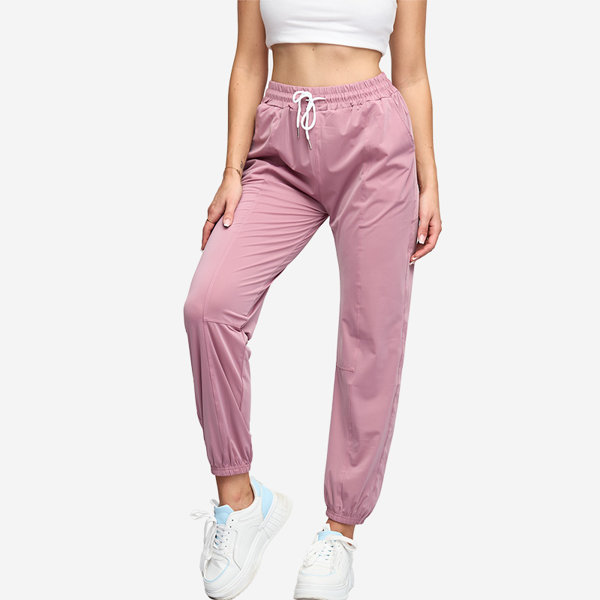 Royalfashion Ciemnoróżowe damskie spodnie dresowe typu joggery